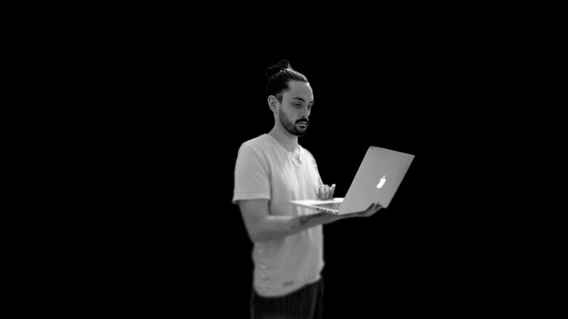 Ghost Canvas Studio founder working on a laptop